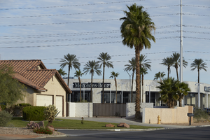 Single family home and auto dealership on Tenaya Way and West Sahara Avenue, looking northwest, Las Vegas, Nevada: digital photograph