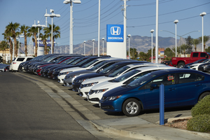 New cars at auto dealership on West Sahara Avenue east of Buffalo Drive, looking west, Las Vegas, Nevada: digital photograph