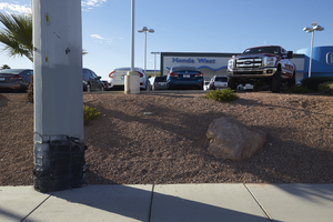 Power pole and cars at auto dealership on West Sahara Avenue east of Buffalo Drive, looking south, Las Vegas, Nevada: digital photograph