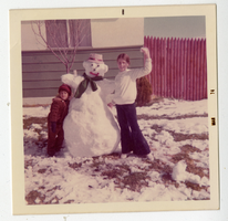 Frank and Niki (Brunetti) Bates with a snowman in North Las Vegas, Nevada: photographic print