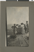 Group near a railroad car, "the Colonel, Mama, Bertie, Wickie, Bill": photographic print