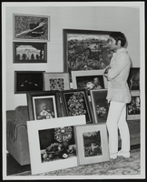 Vassili Sulich with his paintings, image 003: photographic print