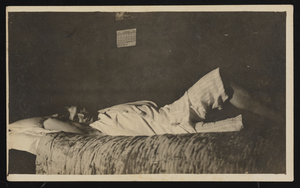 Unidentified man in bed: photographic print