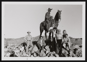 Edwards, Luna, Paher, and unidentified people pose in front of Rafael Rivera statue at Old Vegas: photographic prints