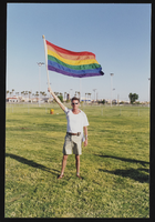 Danny Zeiszler holding a rainbow flag at Gay Pride: photographic print