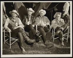 C. Norman Cornwall sits with fellow riders: photographic print
