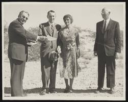Albert S. Henderson (left) marrying a couple in the desert: photographic print