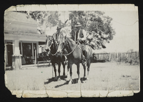 Albert S. Henderson and an unidentified man on horseback: photographic print