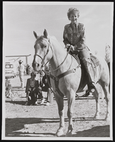 Judy Bayley on horseback: photographic print
