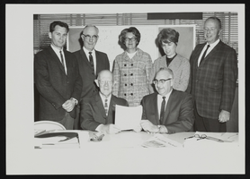 Department of Conservation for the Nevada State Park Commission. Standing, from left to right: Bob Forson, Chris Sheerin, Jean Ford, Thalia Dondero, and Bill Belknap. Seated, from left to right: Colonel Tom Miller and Elmo De Ricco: photographic print