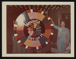 Billie Bates standing next to the Nevada booth at the National Women's Conference, Houston, Texas: photographic print