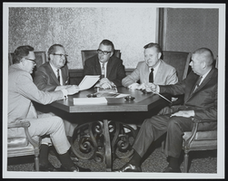 View of meeting with Fred S. Hollister, Alan Bible, Erle Taylor, G. Barney Rawlings, Captain Harrision Finch (identified from left to right): photographic print