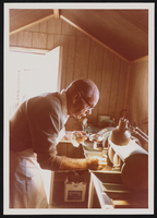 Carl Janish in his lapidary shop: photographic print