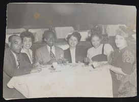 Bill Robinson, Mary and Elaine Plane seated at a table with three other unidentified people (identified from left to right): photographic print