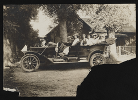 Group of people sitting in car with trees and a house in background at Silver Creek Canyon, Utah: photographic print