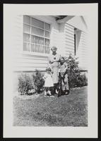 Hazel Denton posed for photograph with two children in front of a house in Las Vegas, Nevada: photographic print