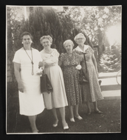 Aileen, Geneva, Hazel, and Ethel Andrews posed in front of house and shrubs (identified from left to right): photographic print