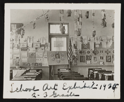 Classroom with student art on walls and ceiling: photographic print