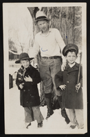 Three boys, Ralph, Lewis, and Jerry, posed in front of tree: photographic print