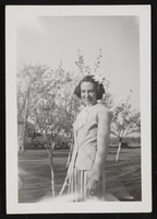 Ethel standing on grass lawn: photographic print