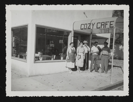 Two women and three men standing in front of the door of Cozy Cafe: photographic print