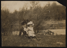 Lou-Vee Bradford Siegfried with Nanelia sitting on a wagon: photographic print