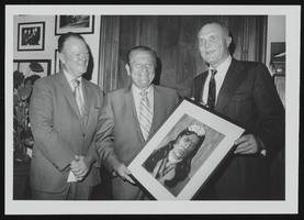 Howard Cannon receiving a painting of Princess Winnemucca by the Nevada Bell company vice-president Paul Garwood and the incoming vice-president Tom Edwards: photographic print