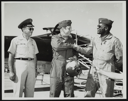 Lieutenant Colonel Randall and Major General R. G. Taylor with Howard Cannon at an airfield: photographic print