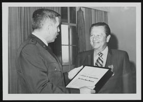 Howard Cannon presented with Legion of Merit by Major General Homer Lewis: photographic print