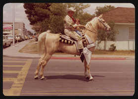 Howard Cannon and Brett (possibly his grandson Brett Bjornsen) on Sunrise, Cannon's palomino horse: photographic print