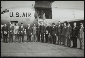 Air Force Ballistic Missile Headquarters, Howard Cannon and others in front of an airplane: photographic print