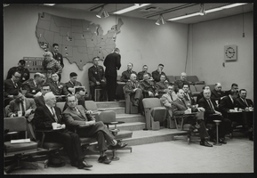Men seated at a conference at Air Force Ballistic Missile Headquarters: photographic print