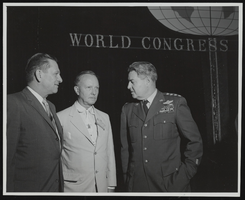 General Curtis E. LeMay discusses highlights of his speech on "Space Age Requirements" with Senators Howard W. Cannon and Stephen Young at the World Congress of Flight, Las Vegas, Nevada: photographic print