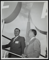 Senators Stephen Young and Howard Cannon entering the access door of the Atlas exhibit at the World Congress of Flight, Las Vegas, Nevada: photographic print