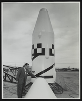 Howard Cannon examines a missile nose cone at the World Congress of Flight, Las Vegas, Nevada: photographic print