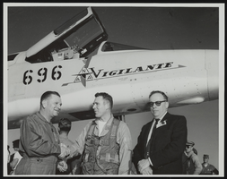 Howard Cannon with others in front of a North American A-5 Vigilante supersonic bomber: photographic print