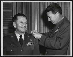 Howard Cannon is congratulated by Lieutenant General Bernard Schriever on Cannon's promotion to Brigadier General: photographic print