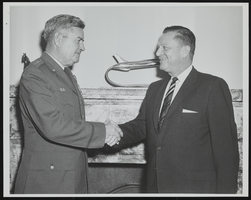 Howard Cannon congratulates General Curtis LeMay on being selected by President John F. Kennedy to serve as Air Force Chief of Staff beginning on June 30th: photographic print