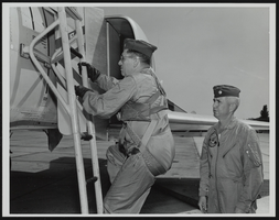 Lieutenant Colonel Jerry F. Hogue watches Howard Cannon climb the ladder to McDonnell F-110, Langley Air Force Base, Virginia: photographic print