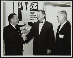 Howard Cannon shaking hands with Omaha Mayor James Dworak while Las Vegas Mayor Oran Gragson watches. Omaha, Nebraska: photographic print