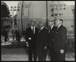 Howard Cannon's tour of the Nevada Facility of North American Aviation with Governor Grant Sawyer, an unidentified man, and Senator Alan Bible.: photographic print