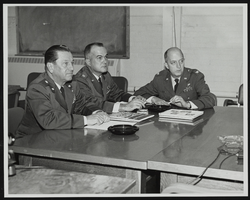 Howard Cannon is given a presentation on the mission of the Air Force Materials Lab by Major General P. B. Fasules and Colonel L. R. Standifer during a visit to the Wright-Patterson Air Force Base, Ohio: photographic print