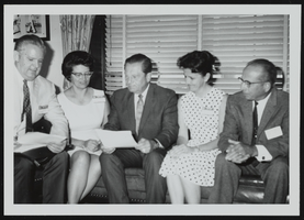 Howard Cannon pictured with four unidentified people: photographic print