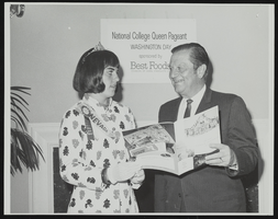 Howard Cannon pictured with a contestant in the National College Queen Pageant: photographic print