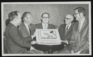 Howard Cannon presenting birthday cake to Judge John Mendoza: photographic print