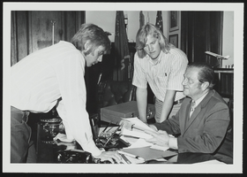 University of Nevada, Las Vegas students Cliff Penwell and Dick Wiseman discuss provisions of the Higher Education Act with Howard Cannon: photographic print