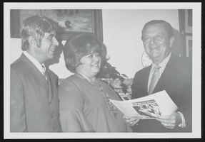 Nancy Austin, winner of the 1971 Small Businessman of the Year Award for Nevada, and her husband, David London, meet with Howard Cannon: photographic print