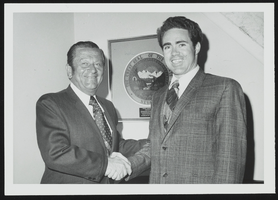 Howard Cannon congratulates University of Nevada, Reno student Jack Warner upon successful completion of his congressional internship in Cannon's office: photographic print