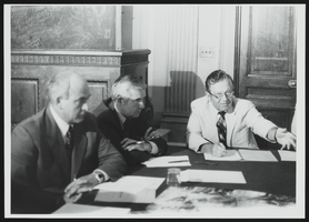 Howard Cannon at a conference table with Senator Paul Laxalt, Governor Mike O'Callaghan and others: photographic print
