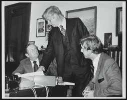 Howard Cannon in his Washington, D.C. office with two other people: photographic print